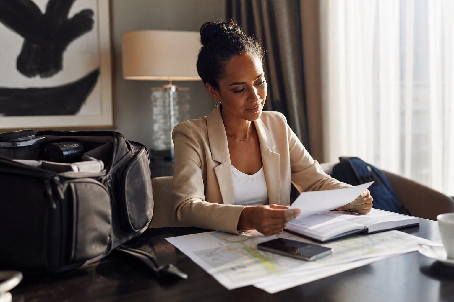 Elopement planner reviewing a travel itinerary and map