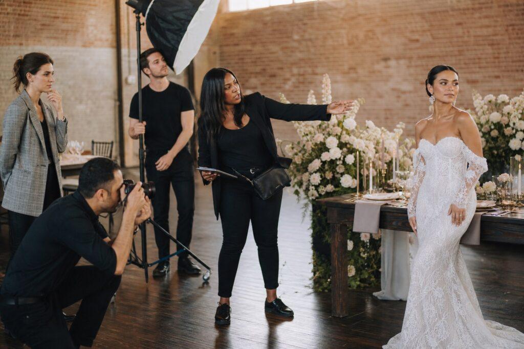 Wedding planner directing a styled shoot for a portfolio